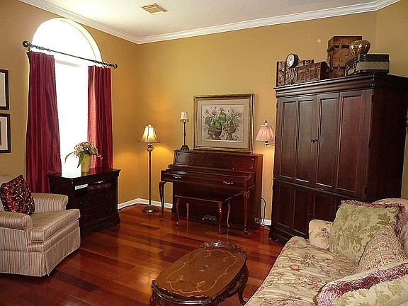 Formal Living Room with Hardwood Floors and Crown Molding.
