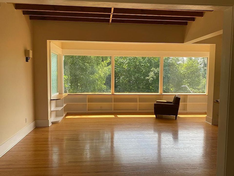 Living room and front window wall facing Green Lake Park.