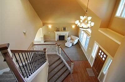 Grand Two-story Entry with wrought-iron staircase