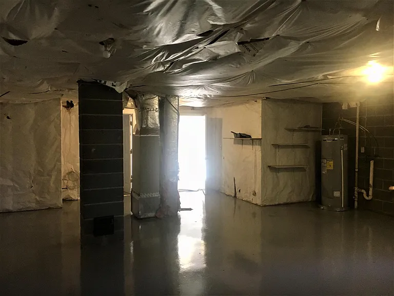 Unfinished portion of basement with washer/dryer hookups