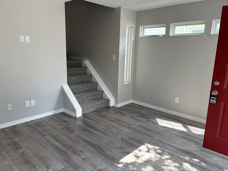 Living room, Stairs lead to 3 bedrooms & Full bath