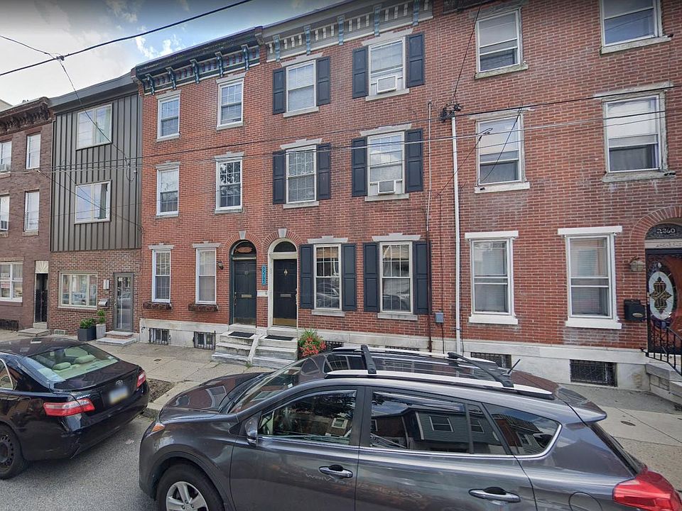 2364 E Norris St (3rd property from the left w dark green door and wooden fish in archway)