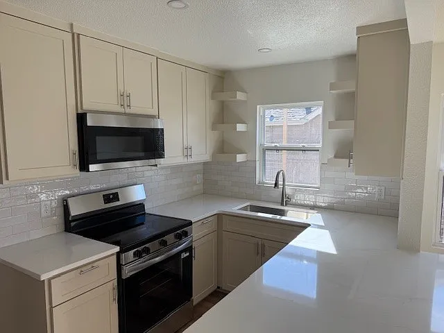 New stainless steel appliances and quartz countertops!