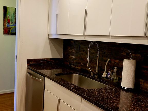 kitchen: a dishwasher, sink with a disposal, large kitchen c