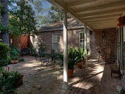Very inviting courtyard entry! Large pvt courtyard landscaped beautifully with brick walls and opens