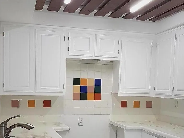 Remodeled kitchen with range hood and gas stove to be installed.