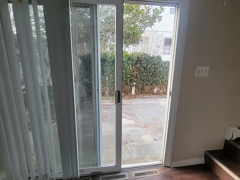 Sliding Doors exit off dining room to Private Patio