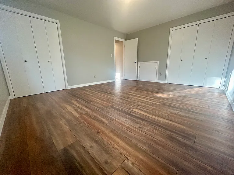 Master bedroom. Two closets and storage crawl space