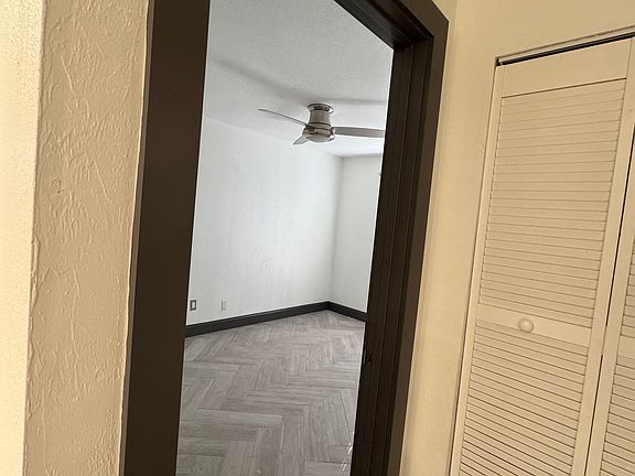Front bedroom with ceiling fan