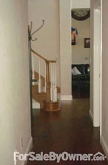 Downstairs Hallway with hardwood floors