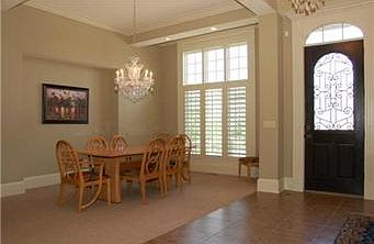 The large formal dining room fits any size table and has a wide recess for a hutch or buffet.