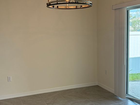 Large dining room with farmhouse chandilier