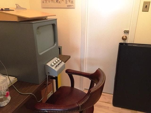 Small room, with table, chair, & closet