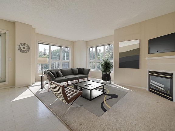 A view of living room with furniture (suite is unfurnished)