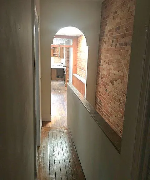 Hall leading from bedrooms to kitchen.