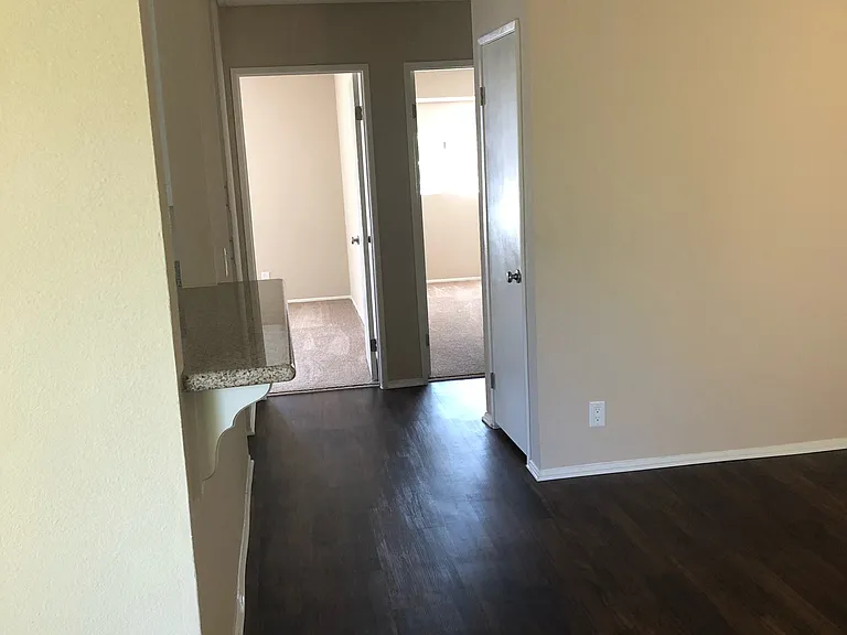 View down hallway from living room entry at Grande Vista Apartments.
