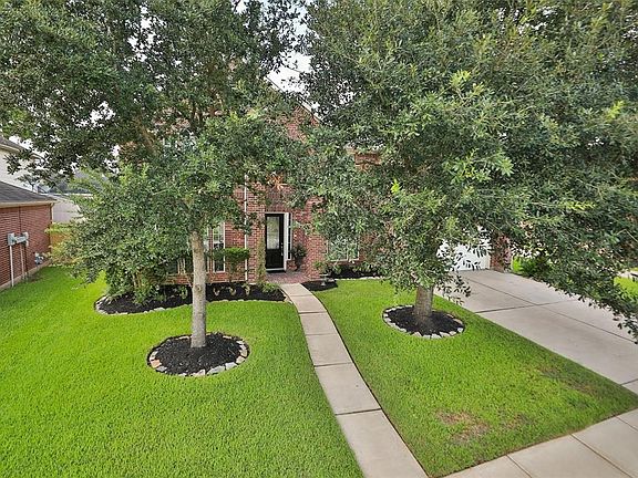 This home has lovely landscaping and curb appeal.