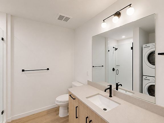Bright bathroom with modern fixtures and sleek finishes.