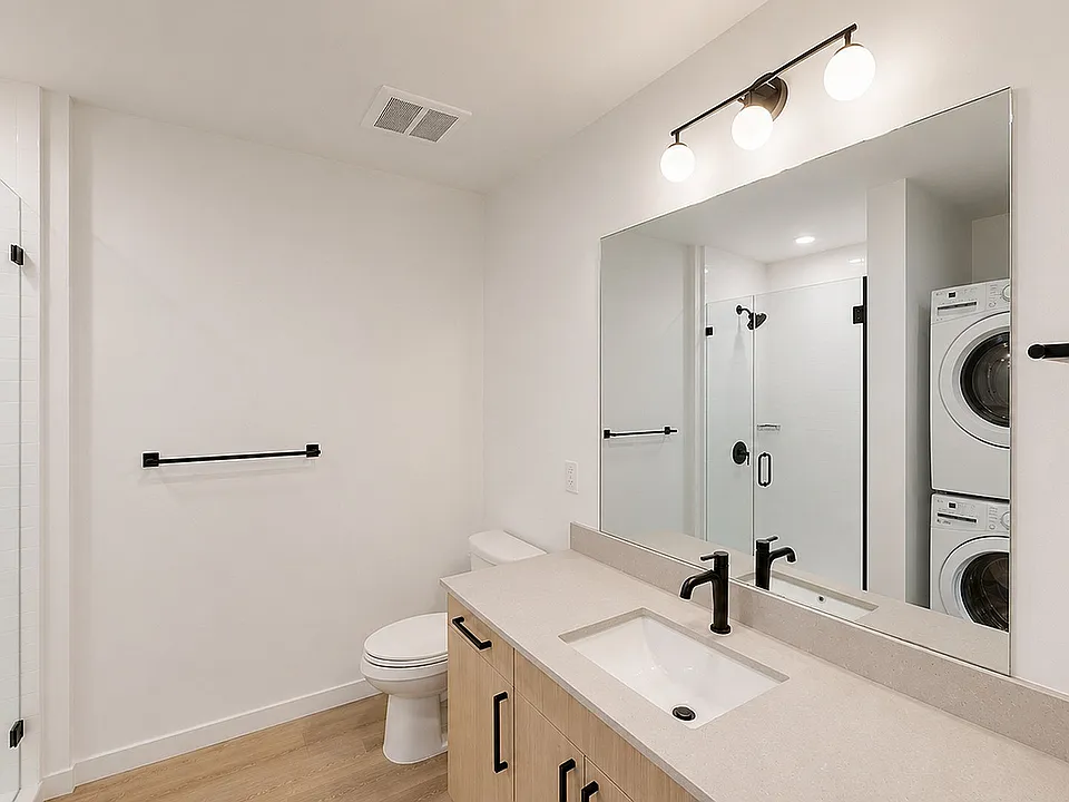 Bright bathroom with modern fixtures and sleek finishes.