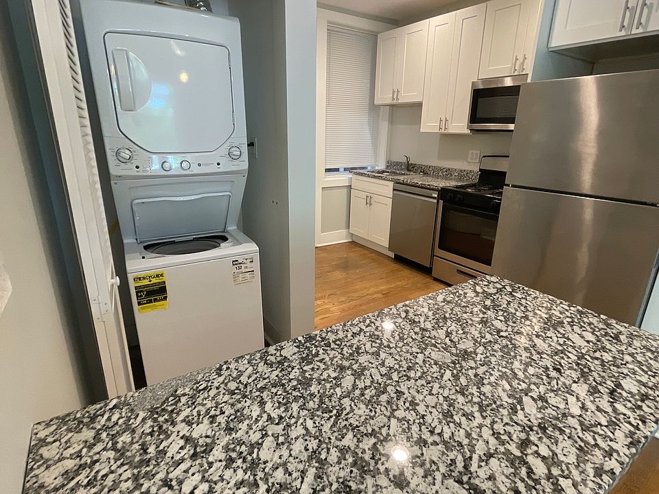 kitchen area w/ in unit washer and dryer.