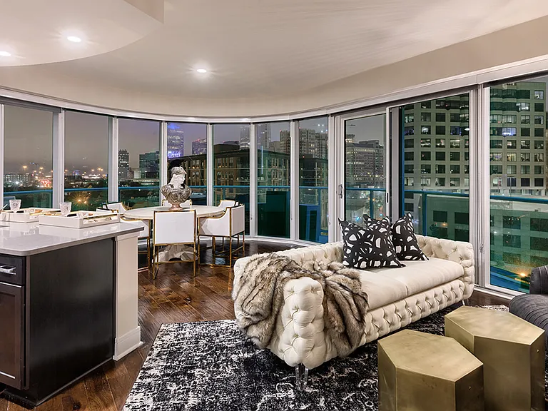 Living room with stunning views, hardwood flooring and floor to ceiling windows