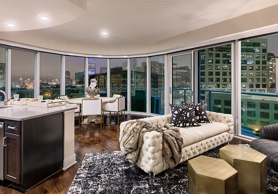 Living room with stunning views, hardwood flooring and floor to ceiling windows