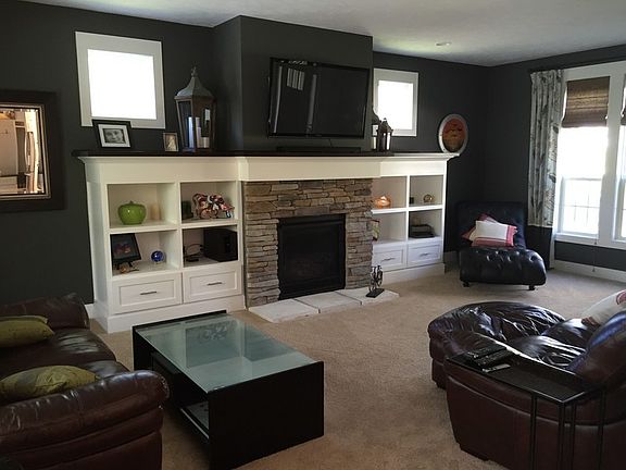 Custom built in shelving and gas fireplace