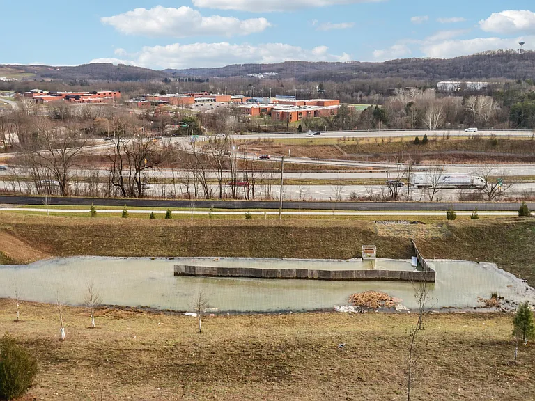 View from walkout basement - pond, community walking trail and Seneca valley school