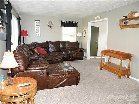 Spacious 1st Floor Living room with Newer Neutral Carpet * Nice Large Windows for Natural Lighting!