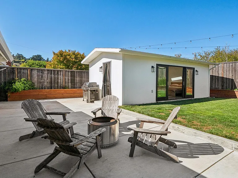Large backyard with fire pit lounge and separate fully furnished studio