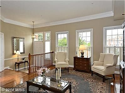 Living Room w/ hardwoods and elaborate muoldings
