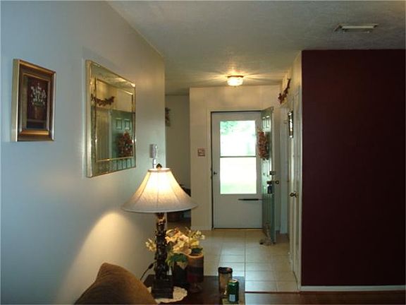 Bright entry with a glass storm door and tile floors!