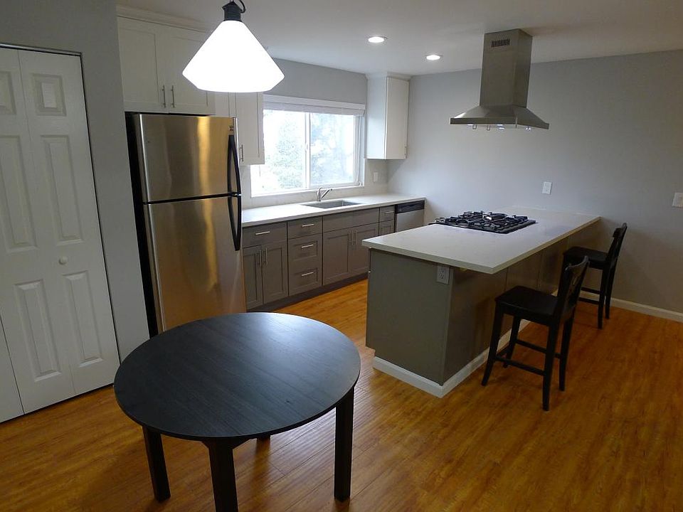 Dining Table with view of Stainless Appliances (Dishwasher t
