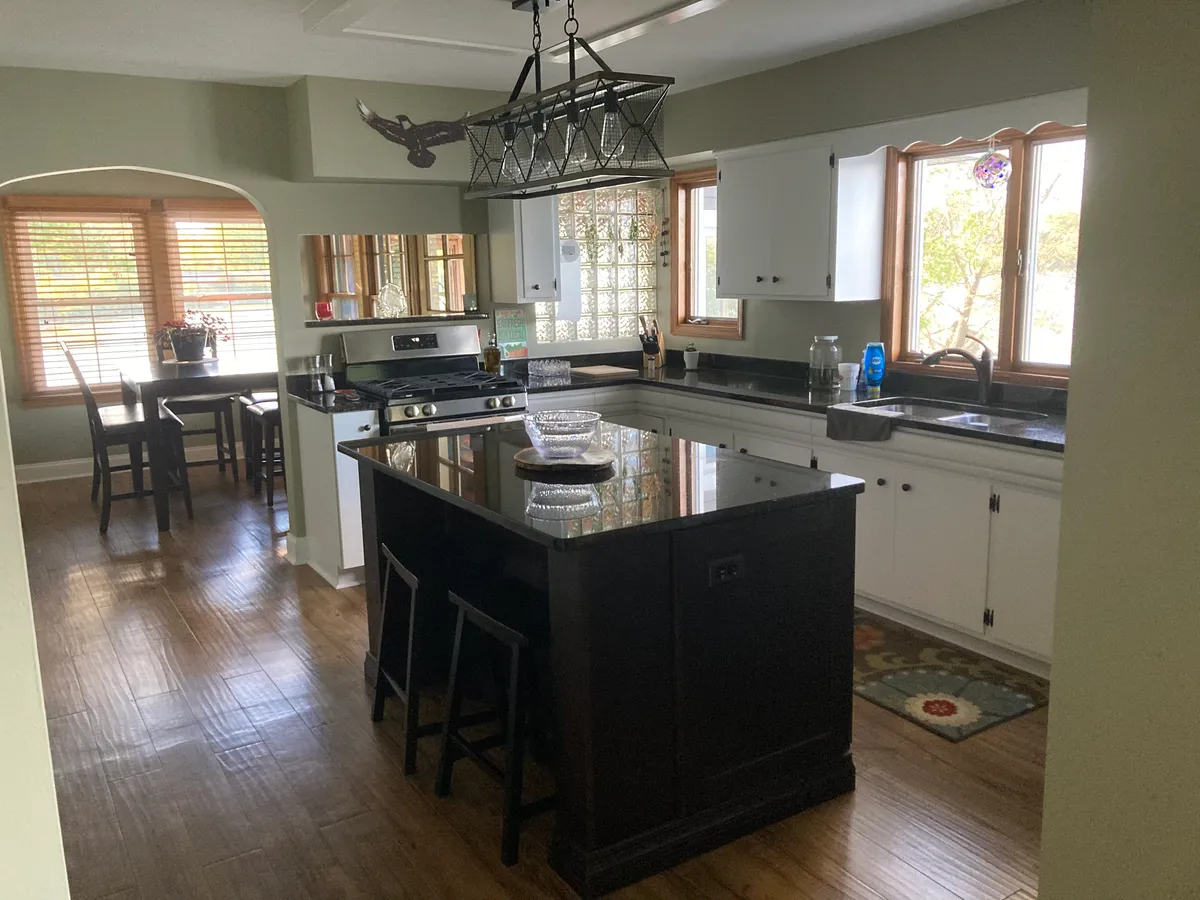 Kitchen with island and dining area - W Larkin Ln