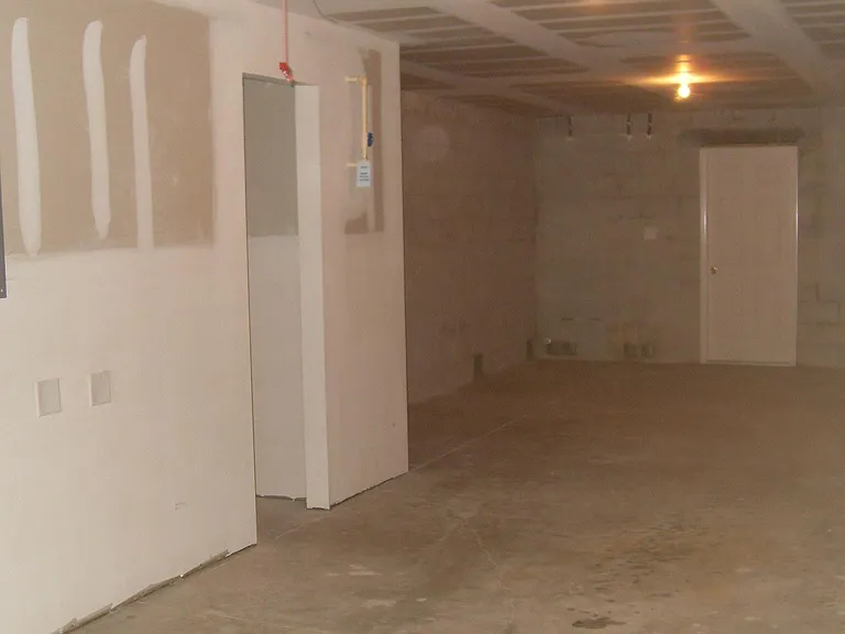 2 car tandem garage. Includes shelving on one side.
