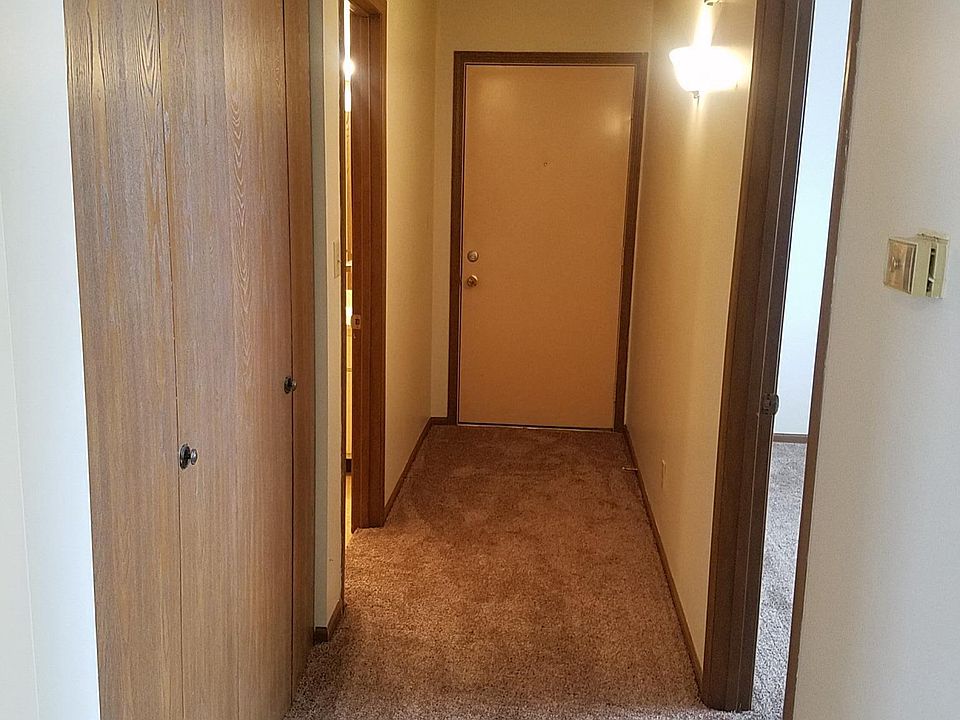 Hall showing front door, bathroom on left, w & d closet on l