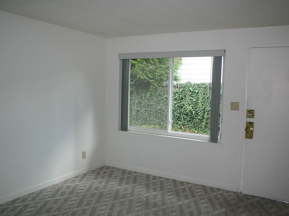 Large front window facing South. New Luxury Vinyl Plank floor to replace carpeting.