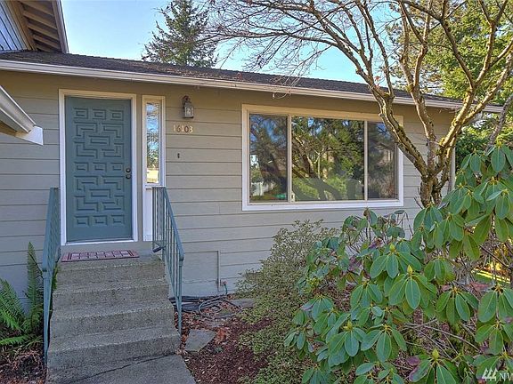 Welcoming entry with established garden beds.  As an added feature, this home is equipped with a 3-layer filter system, decreasing dust and allergens dramatically - wonderful for anyone suffering from allergies!