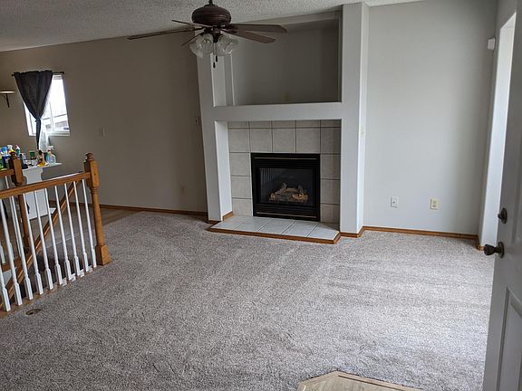 Entry view, gas fireplace with large TV nook.
