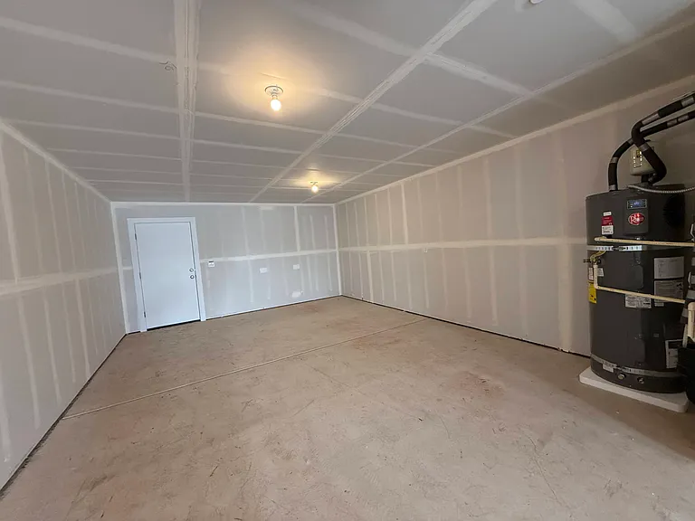 Deep 2 car garage with extra space in the back as storage space