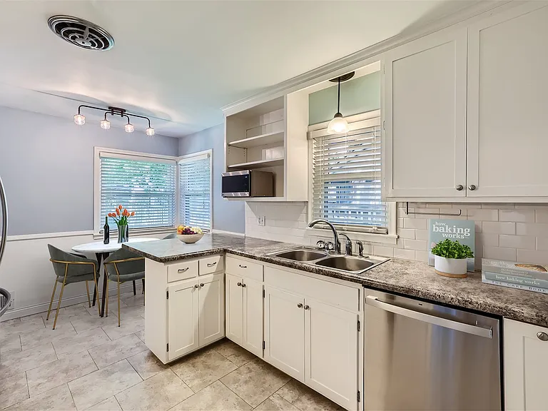 Well appointed eat-in kitchen with stainless appliances.