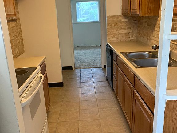 The kitchen has been upgraded with brand new cabinets and countertops