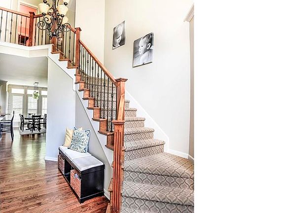 2 sty entry w/ designer carpet.