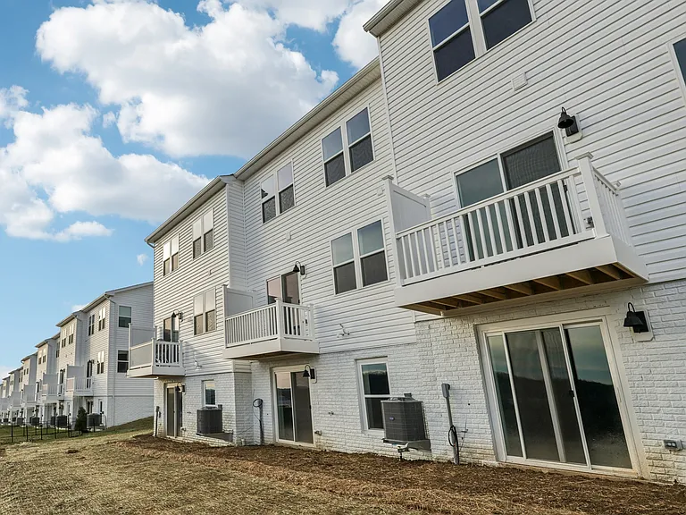 Rear view - walkout basement, first floor deck, level backyard