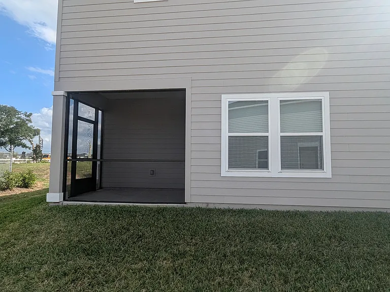 Our townhouse includes a screened-in porch, perfect for relaxing outdoors with added comfort and privacy.