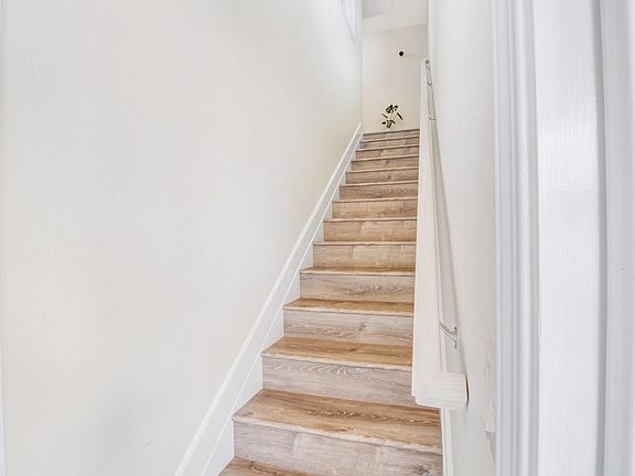 16 steps to 2nd floor to the common space of kitchenette, living room, and balcony.