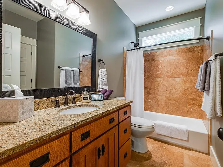 Second bathroom has access to the second bedroom and the grand living room.