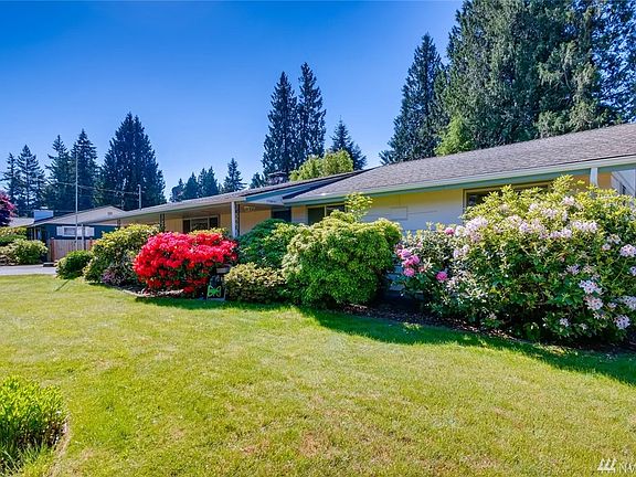 A vast array of colorful landscaping in various spots of this oversized lot! 