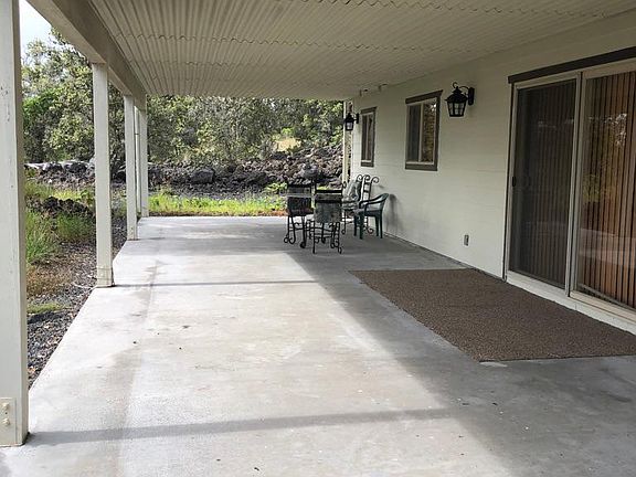 Covered Lanai off the kitchen, dining area and living room.