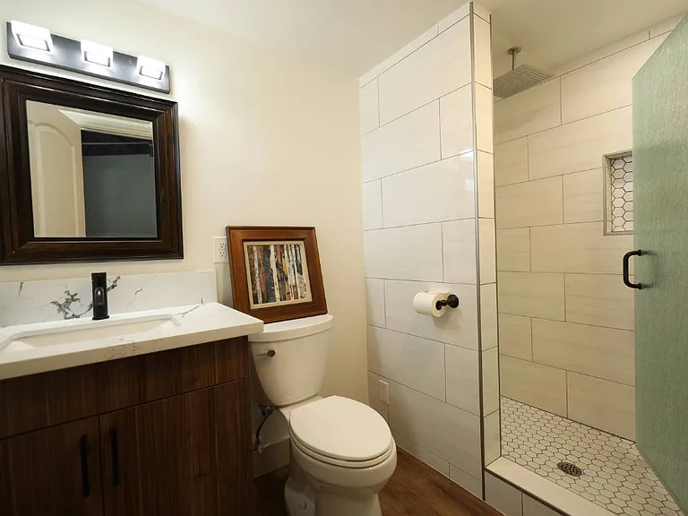 The master bathroom has a rain showerhead.